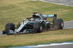 Lewis Hamilton, Mercedes-AMG F1 W09 goes across the grass at pit lane entry