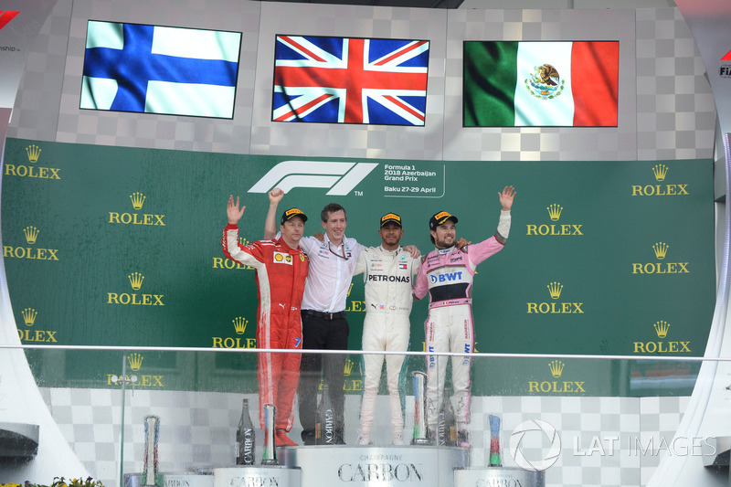 Kimi Raikkonen, Ferrari, Lewis Hamilton, Mercedes-AMG F1 and Sergio Perez, Force India celebrate on the podium