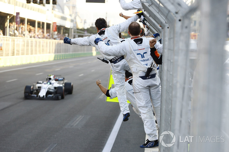 Lance Stroll, Williams FW40, is greeted by his mechanics at the finish