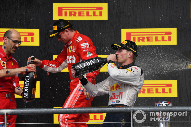(L to R): Carlo Santi, Ferrari Race Engineer, Kimi Raikkonen, Ferrari and Max Verstappen, Red Bull Racing celebrate with the champagne
