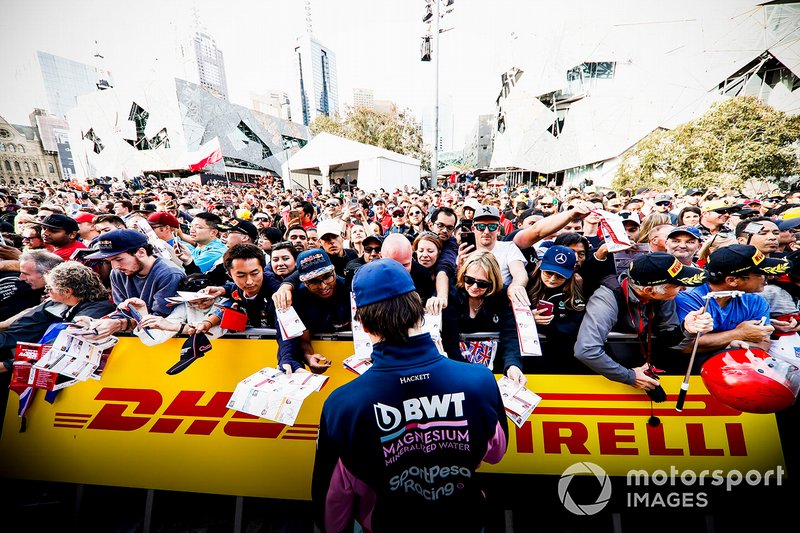 Lance Stroll, Racing Point signs autographs for fans at the Federation Square event