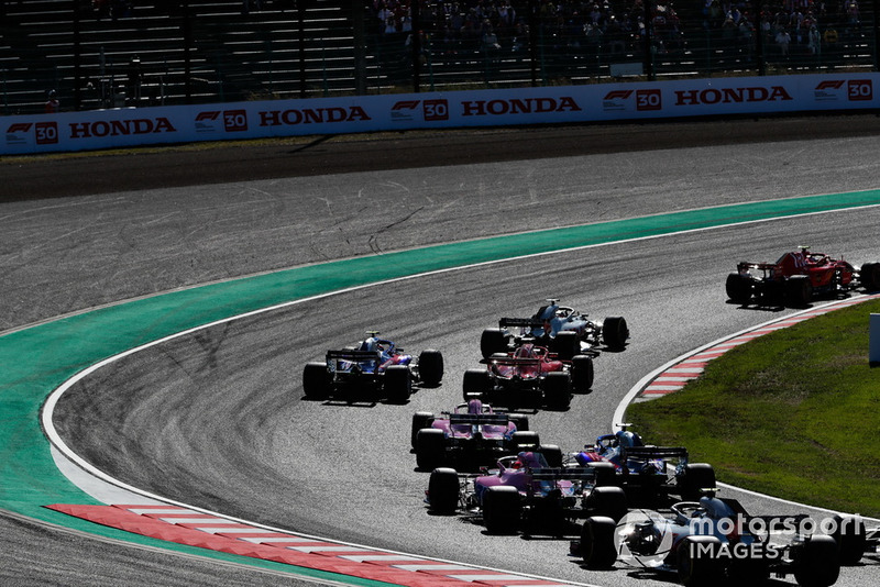 Kimi Raikkonen, Ferrari SF71H, leads Romain Grosjean, Haas F1 Team VF-18, Sebastian Vettel, Ferrari SF71H, Brendon Hartley, Toro Rosso STR13, and Sergio Perez, Racing Point Force India VJM11, Pierre Gasly, Scuderia Toro Rosso STR13, and Esteban Ocon, Racing Point Force India VJM11