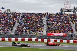 Kimi Raikkonen, Ferrari SF16-H leads Nico Hulkenberg, Sahara Force India F1 VJM09