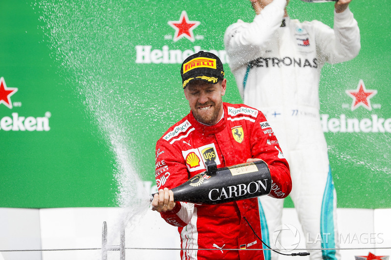 Sebastian Vettel, Ferrari, 1st position, sprays the victory Champagne