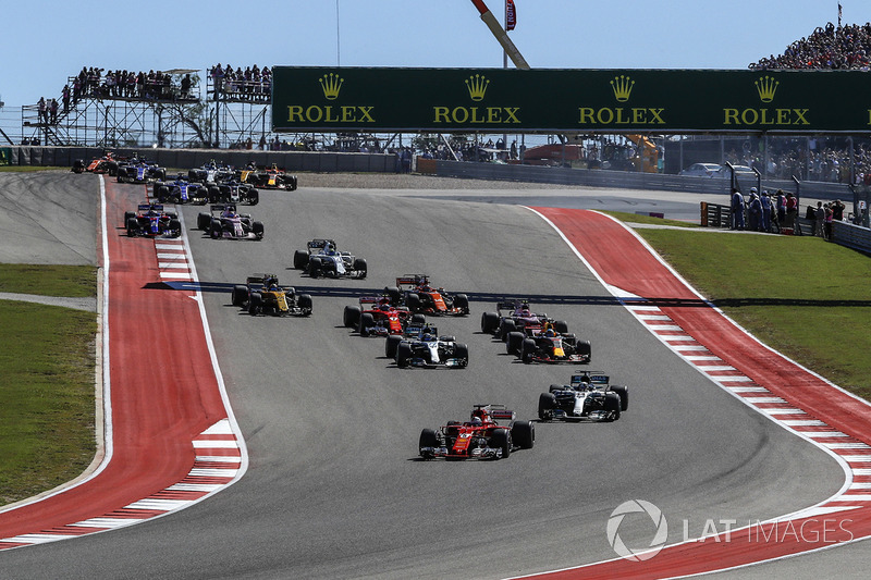 Sebastian Vettel, Ferrari SF70H leads Lewis Hamilton, Mercedes-Benz F1 W08  at the start of the race