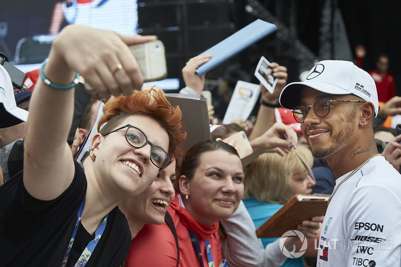 Lewis Hamilton, Mercedes AMG F1, poses for fan to take a picture
