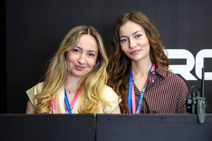 Olivia Hartley and Hannah Atkinson pose for a photo in the CUPRA KIRO garage 