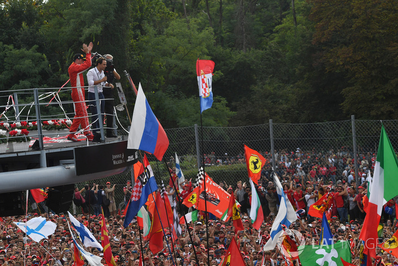 Second place Kimi Raikkonen, Ferrari celebrates on the podium with Felipe Massa 