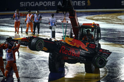 The car of Max Verstappen, Red Bull Racing RB13 is recovered by Marshals after crashing out at the start of the race