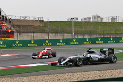 Lewis Hamilton, Mercedes AMG F1 W07 Hybrid runs wide as Sebastian Vettel, Ferrari SF16-H passes