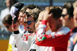 Fernando Alonso, McLaren as the grid observes the national anthem