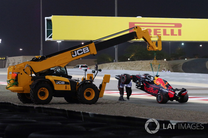 The car of race retiree Daniel Ricciardo, Red Bull Racing RB14 is recovered