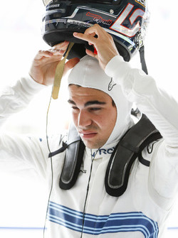 Lance Stroll, Williams Racing, puts his helmet on