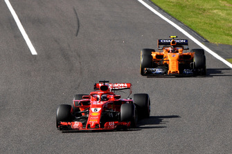 Sebastian Vettel, Ferrari SF71H leads Stoffel Vandoorne, McLaren MCL33