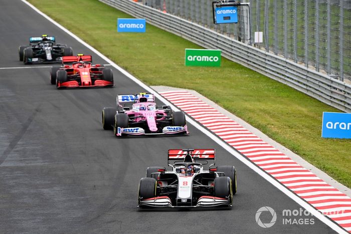 Romain Grosjean, Haas VF-20, leads Lance Stroll, Racing Point RP20, Charles Leclerc, Ferrari SF1000, and Valtteri Bottas, Mercedes F1 W11