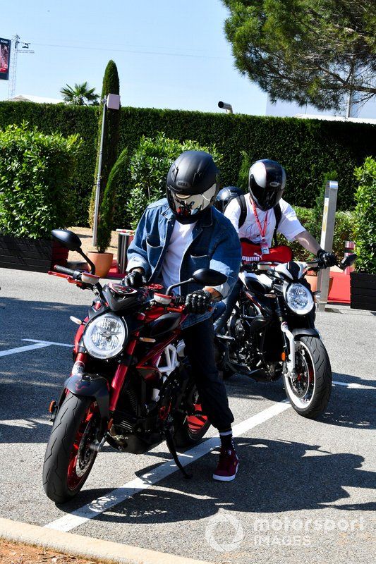 Lewis Hamilton, Mercedes AMG F1 arrives on his motorbike 