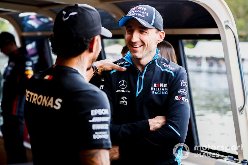 Lewis Hamilton, Mercedes AMG F1 and Robert Kubica, Williams Racing on the way to the Federation Square event