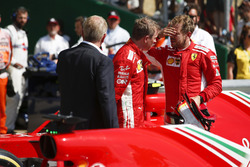 Kimi Raikkonen, Ferrari, talks to Race winner Sebastian Vettel, Ferrari, in Parc Ferme