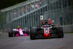 Romain Grosjean, Haas F1 Team VF-18, leads Esteban Ocon, Force India VJM11