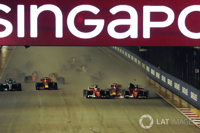 Sebastian Vettel, Ferrari SF70H leads at the start of the race and the cars of Kimi Raikkonen, Ferrari SF70H and Max Verstappen, Red Bull Racing RB13 crash after colliding