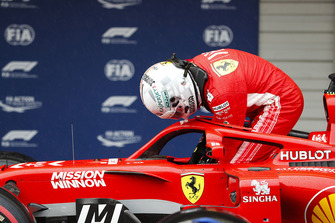 Sebastian Vettel, Ferrari, exits his car in parc ferme