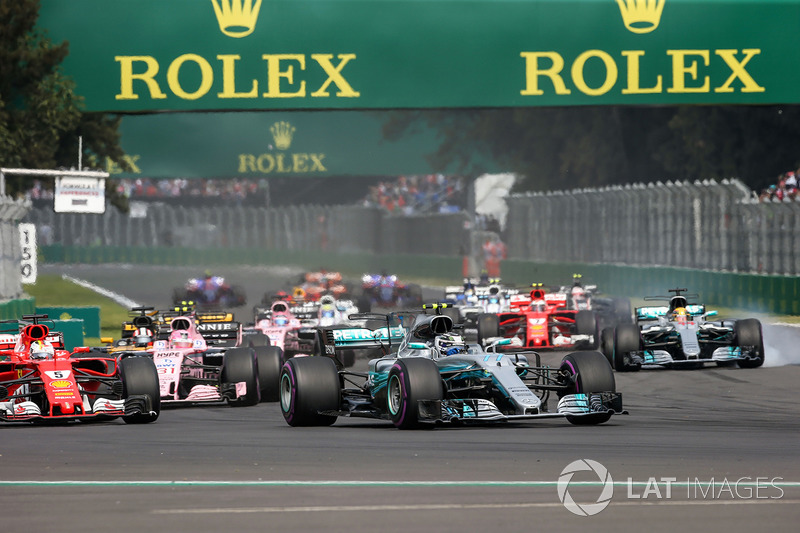 Valtteri Bottas, Mercedes-Benz F1 W08  and Lewis Hamilton, Mercedes-Benz F1 W08  with rear puncture 