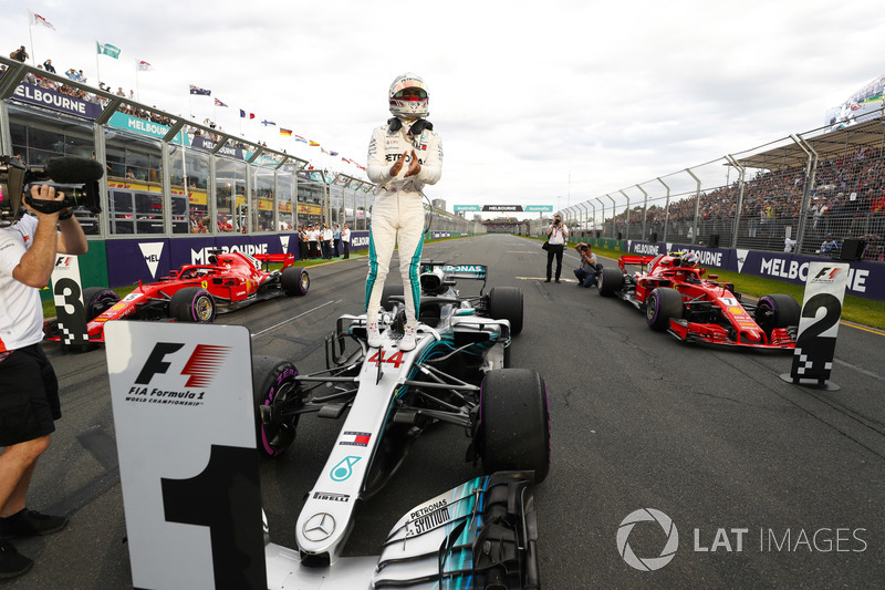 Lewis Hamilton, Mercedes AMG F1, celebrates taking pole position on the pit straight