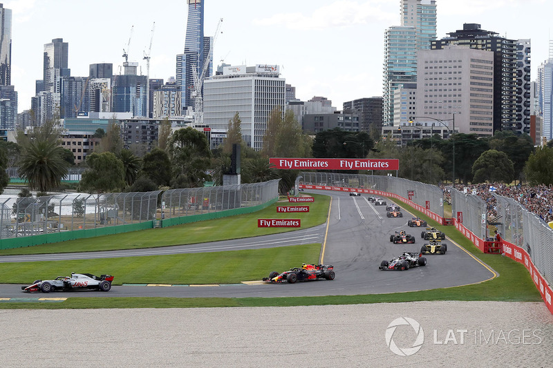 Kevin Magnussen, Haas F1 Team VF-18 leads Max Verstappen, Red Bull Racing RB14 at the start of the r