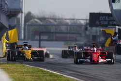 Sebastian Vettel, Ferrari SF70H, leads Jolyon Palmer, Renault Sport F1 Team RS17. and Esteban Ocon,