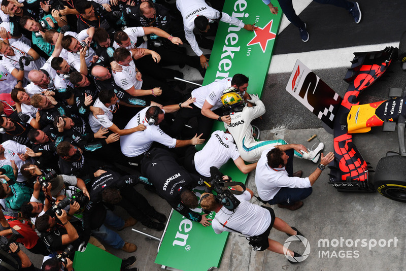 Barriers collapse as Lewis Hamilton, Mercedes AMG F1 celebrates with his mechanics in Parc Ferme 