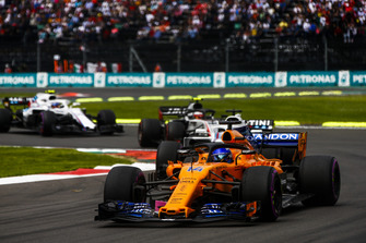 Fernando Alonso, McLaren MCL33, leads Lance Stroll, Williams FW41, Kevin Magnussen, Haas F1 Team VF-18, and Sergey Sirotkin, Williams FW41