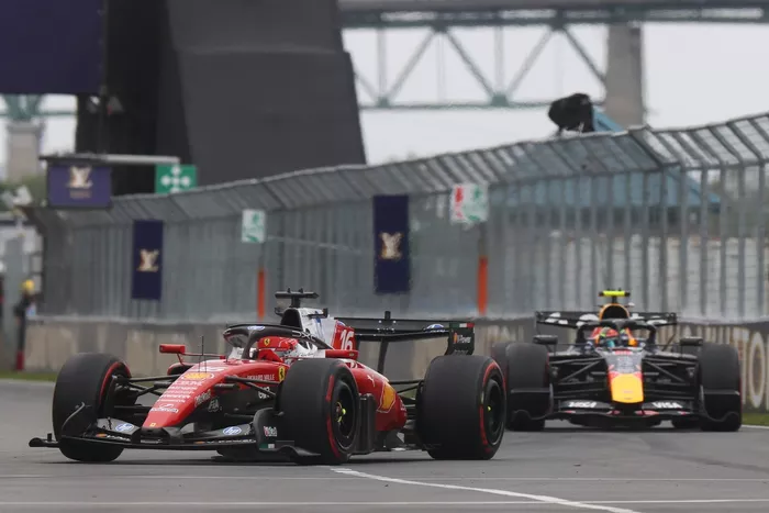 Charles Leclerc, Ferrari; Isack Hadjar, Red Bull Racing