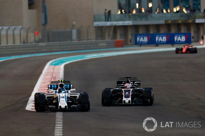 Lance Stroll, Williams FW40 leads Romain Grosjean, Haas F1 Team VF-17