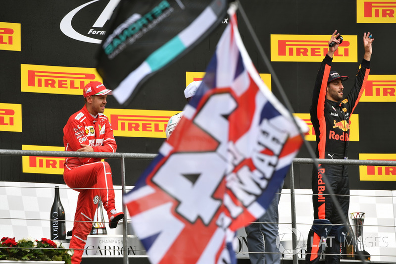 Sebastian Vettel, Ferrari and Daniel Ricciardo, Red Bull Racing, celebrate on the podium