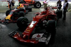 The damaged cars of Max Verstappen, Red Bull Racing RB13 and Kimi Raikkonen, Ferrari SF70H after crashing out at the start of the race