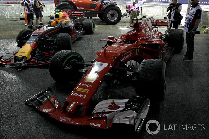 The damaged cars of Max Verstappen, Red Bull Racing RB13 and Kimi Raikkonen, Ferrari SF70H after cra