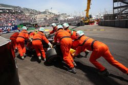 Marshals recover the crashed car of Max Verstappen, Red Bull Racing RB14