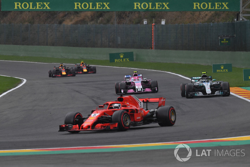 Sebastian Vettel, Ferrari SF71H leads Esteban Ocon, Racing Point Force India VJM11 and Valtteri Bottas, Mercedes AMG F1 W09