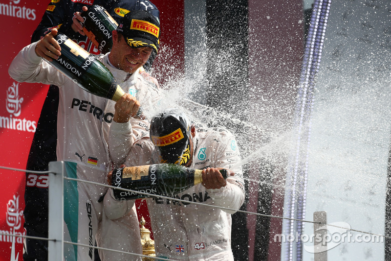 Podium: Race winner Hamilton, Mercedes AMG F1 W07 and second place Nico Rosberg, Mercedes AMG Petronas F1 W07 celevarte with champagne