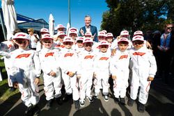 Sean Bratches, Managing Director of Commercial Operations, Formula One Group, poses with Grid Kids