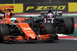 Fernando Alonso, McLaren MCL32 and Romain Grosjean, Haas F1 Team VF-17 battle