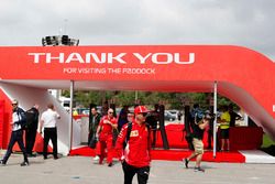 Kimi Raikkonen, Ferrari, and Robert Kubica, Williams Martini Racing, arrive in the paddock