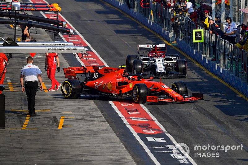 Charles Leclerc, Ferrari SF90, leaves the garage ahead of Kimi Raikkonen, Alfa Romeo Racing C38