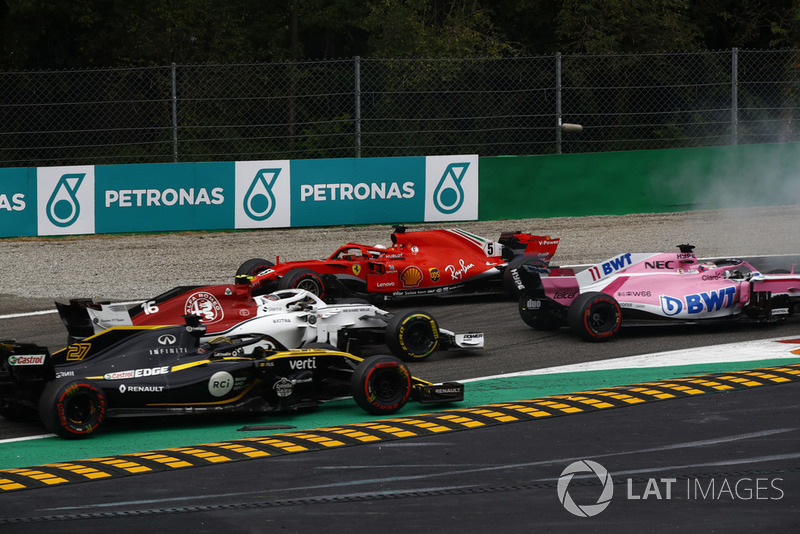 Sebastian Vettel, Ferrari SF71H lighting up his tyres after making contact with Lewis Hamilton, Mercedes AMG F1 W09