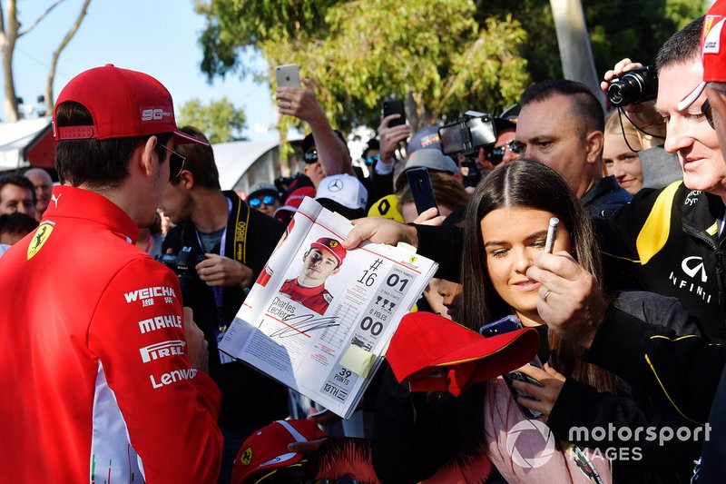 Charles Leclerc, Ferrari, signs an autograph