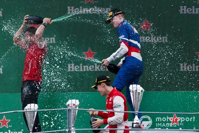 Marcus Armstrong, PREMA Racing, Race winner Robert Shwartzman, PREMA Racing on the podium with the champagne