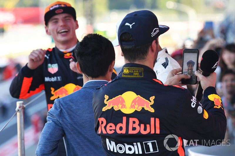 Daniel Ricciardo, Red Bull Racing celebrates with his phone on the podium