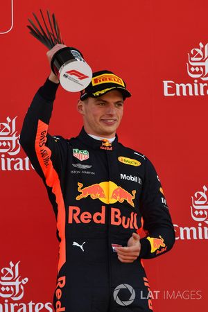 Max Verstappen, Red Bull Racing celebrates on the podium with the trophy