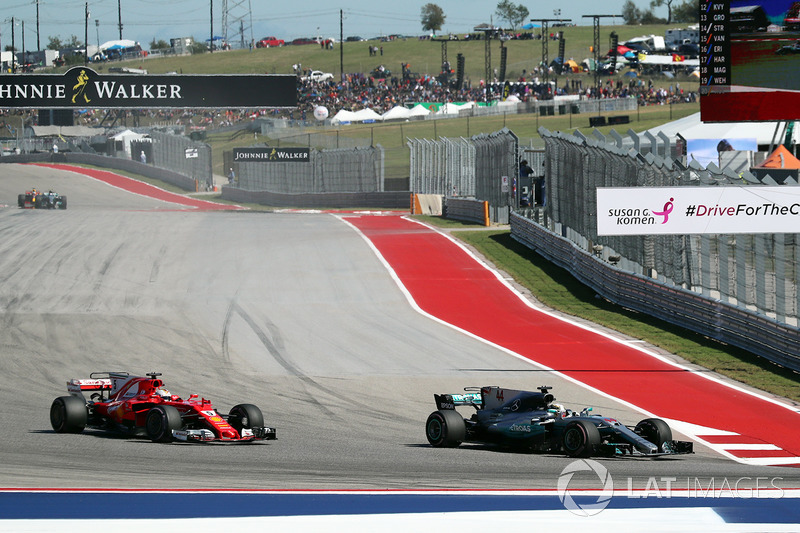 Lewis Hamilton, Mercedes AMG F1 W08 passes Sebastian Vettel, Ferrari SF70-H