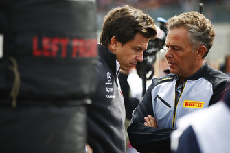 Mario Isola, Racing Manager, Pirelli Motorsport, talks to Toto Wolff, Executive Director (Business), Mercedes AMG, on the grid